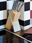 10107117-stainless-steel-knives-set-on-stand-in-kitchen-interior