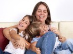 14468508-portrait-of-family-mother-playing-with-children-at-home